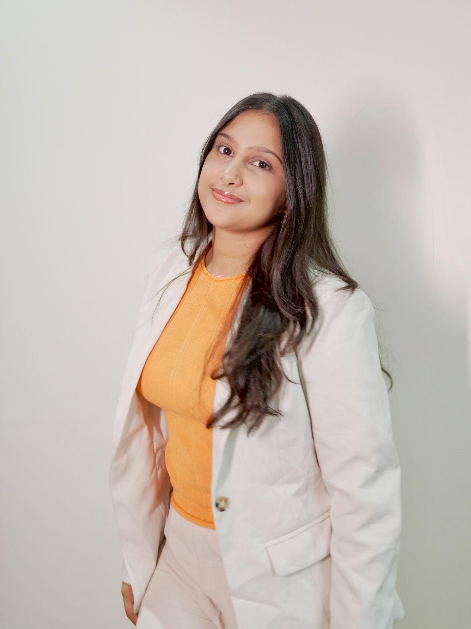 A professional studio portrait of Akanksha Shah, the founder of Akyora.